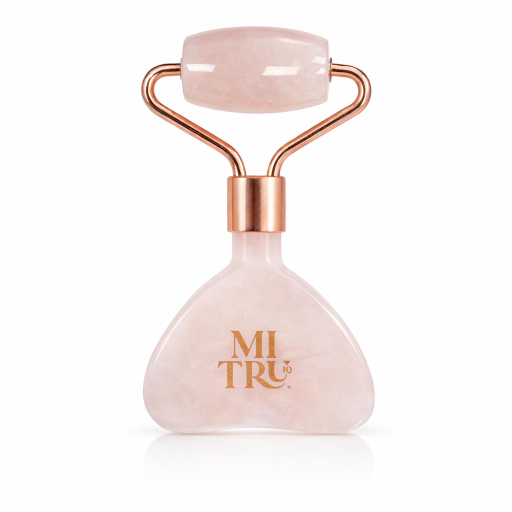 Rose quartz facial roller with rose gold accents on a white background, branded &