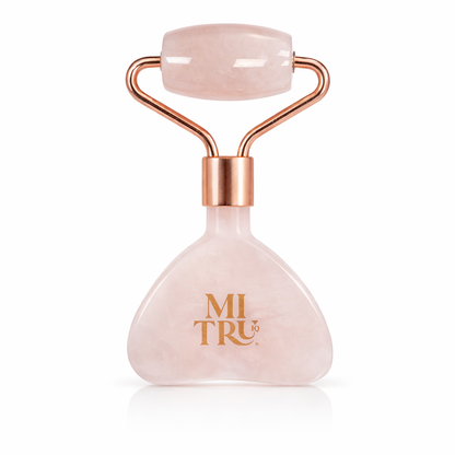 Rose quartz facial roller with rose gold accents on a white background, branded &